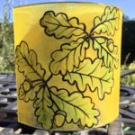 Fused glass hand painted free standing panel of an oak branch with acorns
