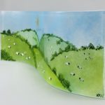 Side view showing hand-painted glass detail and organic design