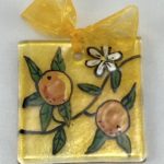 Suncatcher close up with sicilian oranges design