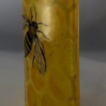 Close up of bee and honeycomb glass design
