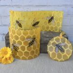 Range of fused glass decorations featuring honeybees