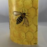 Bee fused glass panel in soft lighting